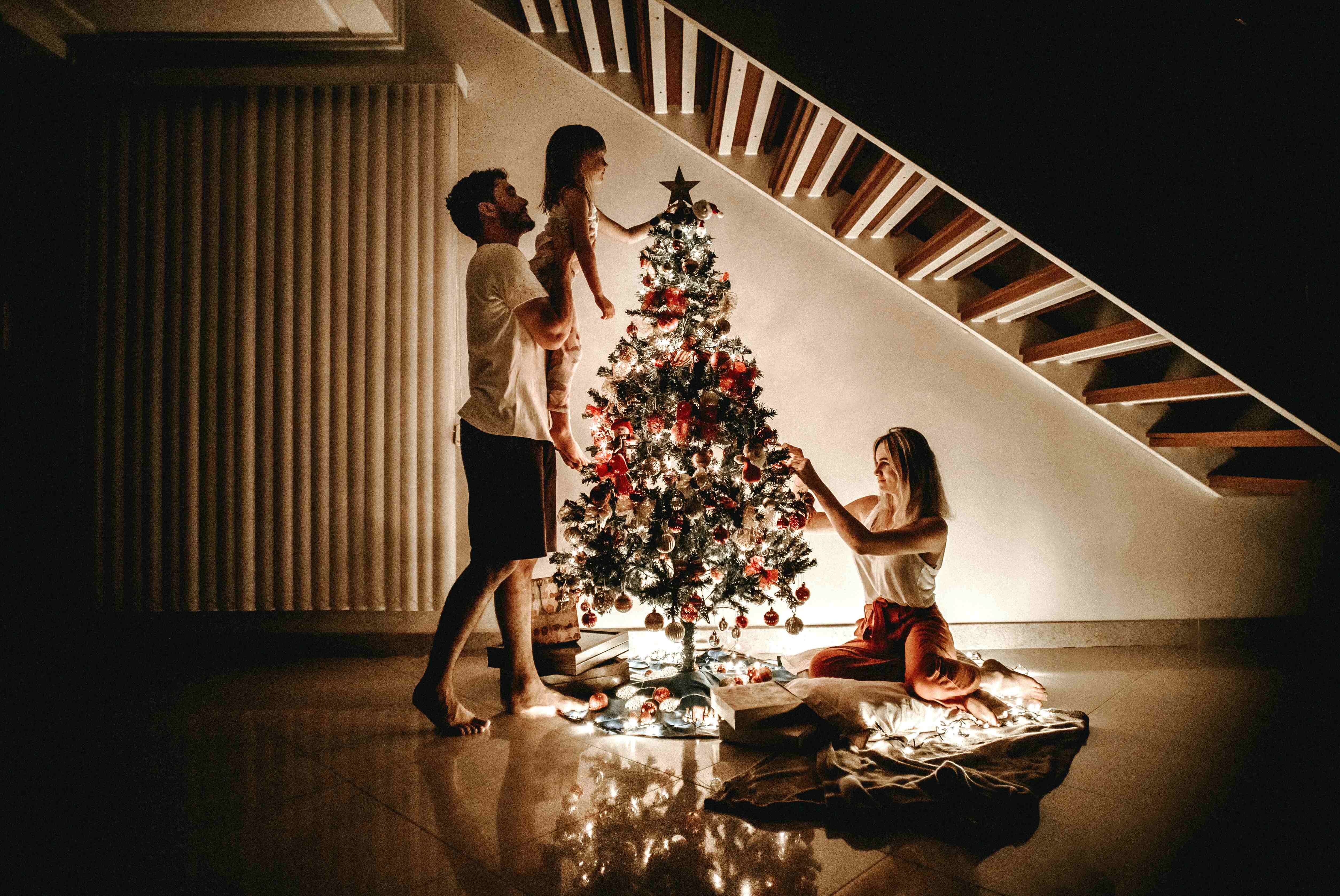 Family by Christmas tree